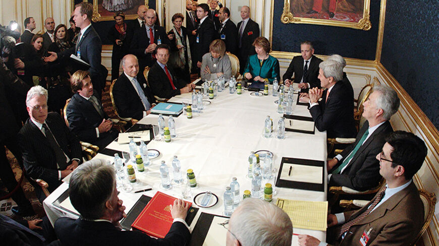 French Foreign Minister Laurent Fabius (3rd L), EU envoy Catherine Ashton (6th L), U.S. Secretary of State John Kerry (3rd R) and Britain's Foreign Secretary Philip Hammond (front L) sit a a table during talks in Vienna November 21, 2014. Iran, the United States, Britain, France, Germany, Russia and China began the final round of negotiations on a nuclear deal on Tuesday. Officials close to the talks have said the two sides are unlikely to secure a final agreement and may need to extend the negotiations. R