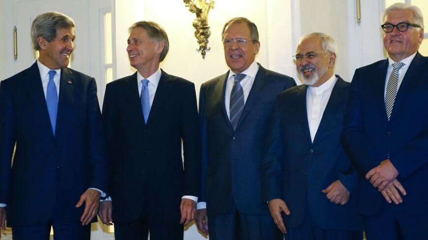 U.S. Secretary of State John Kerry, Britain's Foreign Secretary Philip Hammond, Russian Foreign Minister Sergei Lavrov, Iranian Foreign Minister Javad Zarif and German Foreign Minister Frank-Walter Steinmeier (LtoR) pose for photographers before a meeting in Vienna November 24, 2014. Iran, the United States and other world powers are all but certain to miss Monday's deadline for negotiations to resolve a 12-year stand-off over Tehran's atomic ambitions, forcing them to seek an extension, sources say. The ta