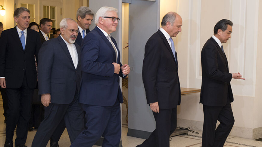 Britain's Foreign Secretary Philip Hammond, Iranian Foreign Minister Mohammad Javad Zarif, US Secretary of State John Kerry, German Foreign Minister Frank-Walter Steinmeier, French Foreign Minister Laurent Fabius and Chinese Foreign Minister Wang Yi arrive for a family picture during their meeting in Vienna November 24, 2014. Iran, the United States and other world powers are all but certain to miss Monday's deadline for negotiations to resolve a 12-year stand-off over Tehran's atomic ambitions, forcing th
