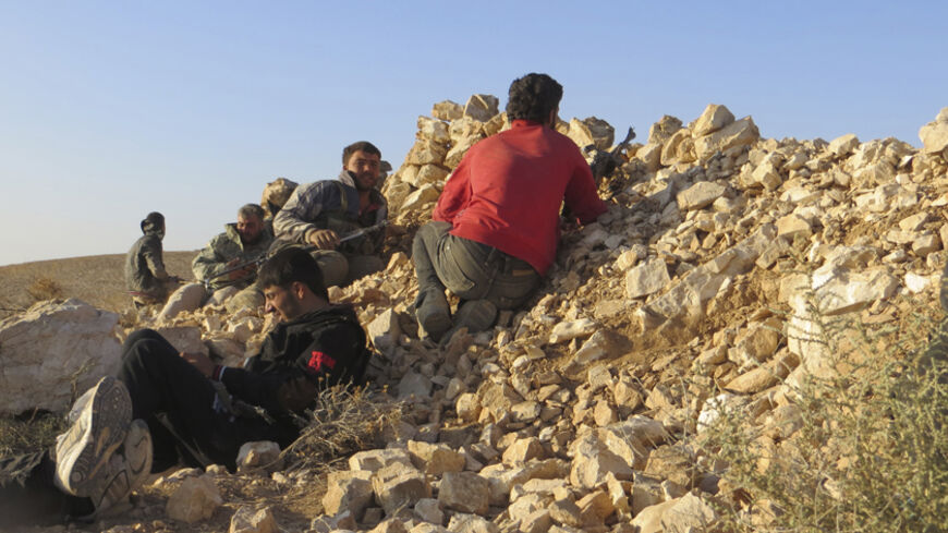 Free Syrian Army fighters take positions in Deraa during what they said an offensive to liberate the checkpoint No. 41, a border point with Jordan, June 14, 2013. Picture taken June 14, 2013. REUTERS/Ali Abu Salah/Shaam News Network/Handout via Reuters (SYRIA - Tags: CONFLICT) ATTENTION EDITORS - THIS PICTURE WAS PROVIDED BY A THIRD PARTY. REUTERS IS UNABLE TO INDEPENDENTLY VERIFY THE AUTHENTICITY, CONTENT, LOCATION OR DATE OF THIS IMAGE. FOR EDITORIAL USE ONLY. NOT FOR SALE FOR MARKETING OR ADVERTISING CAM
