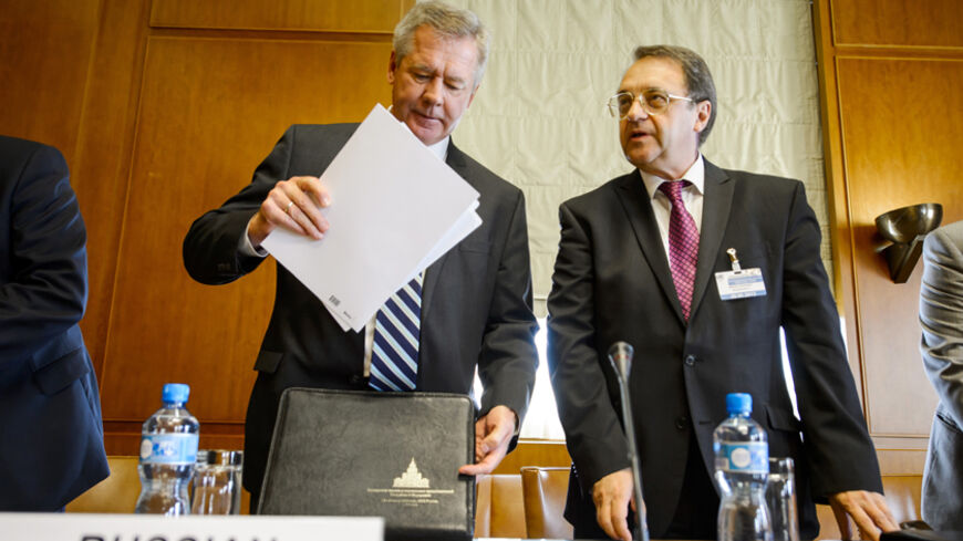 Russia Deputy Minister for Foreign Affairs Mikhail Bogdanov (L) and Deputy Minister for Foreign Affairs Gennady Gatilov prepare for a meeting on Syria at the United Nations European headquarters in Geneva June 25, 2013.  REUTERS/Fabrice Coffrini (SWITZERLAND - Tags: POLITICS) - RTX110CN