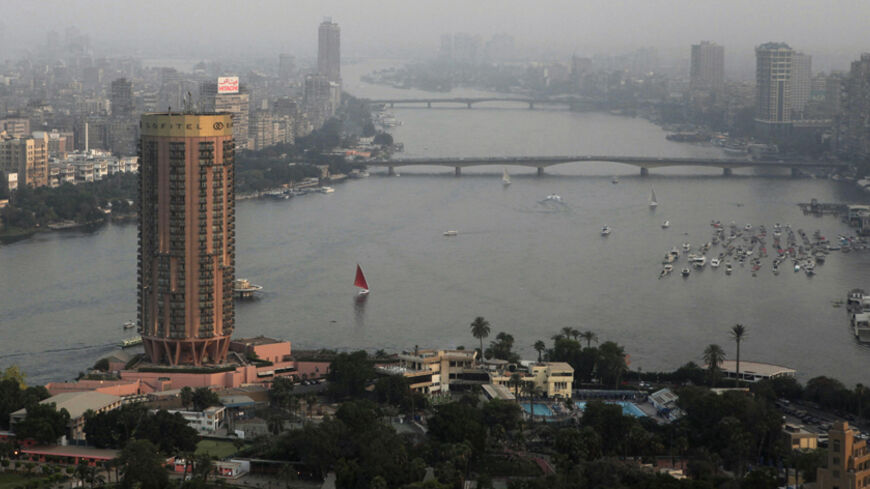 Boats sail on the river Nile in Cairo June 12, 2013. Most of Egypt's population live clustered around the Nile valley and delta, and the river is both a vital resource for the country's citizens, and a potent national symbol. In a recent dispute with Ethiopia over the construction of a dam upstream, Egypt's foreign minister Mohamed Kamel Amr underlined the country's reliance on the river's waters: "No Nile - no Egypt," he said. Picture taken June 12, 2013. REUTERS/Asmaa Waguih (EGYPT - Tags: POLITICS SOCIET