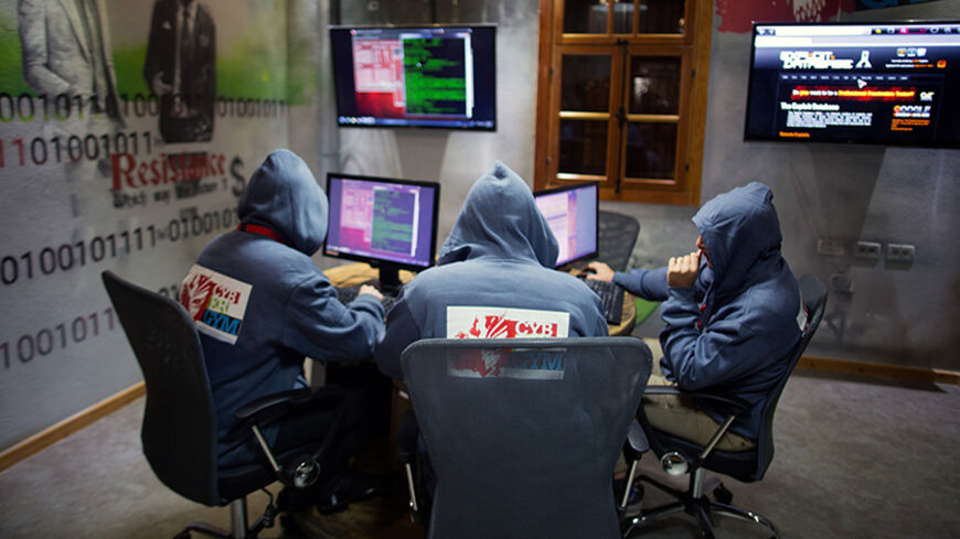 TO GO WITH AFP STORY BY JOHN DAVISON - Trainees work in front of their computers at the "Cyber Gym" center, where IT and infrastructure company employees train to defend against cyber attacks on October 30, 2013 near the Israeli city of Hadera. The facility, a series of small buildings in the shadow of the looming Orot Rabin power station on Israel's northern coastline, was inaugurated this month by the Israel Electric Corp (IEC), which has experienced its fair share of cyber attacks.  AFP PHOTO/MENAHEM KAH