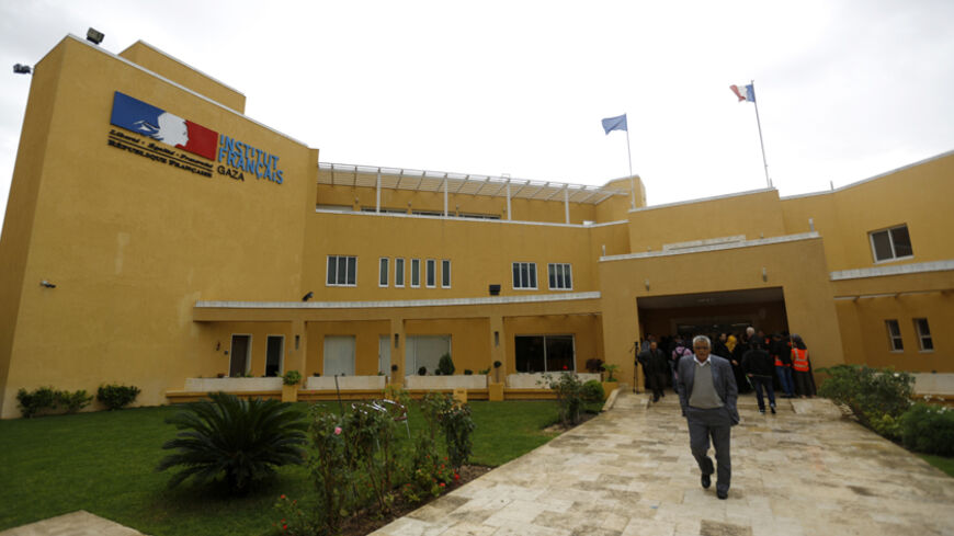 A picture taken on December 14, 2014 in Gaza City shows the entrance of the French Cultural Center that was slightly damaged by a bomb attack on December 12. On October 8, the centre's offices were set ablaze after the apparent explosion of two faulty fuel tanks.  AFP PHOTO/MOHAMMED ABED        (Photo credit should read MOHAMMED ABED/AFP/Getty Images)