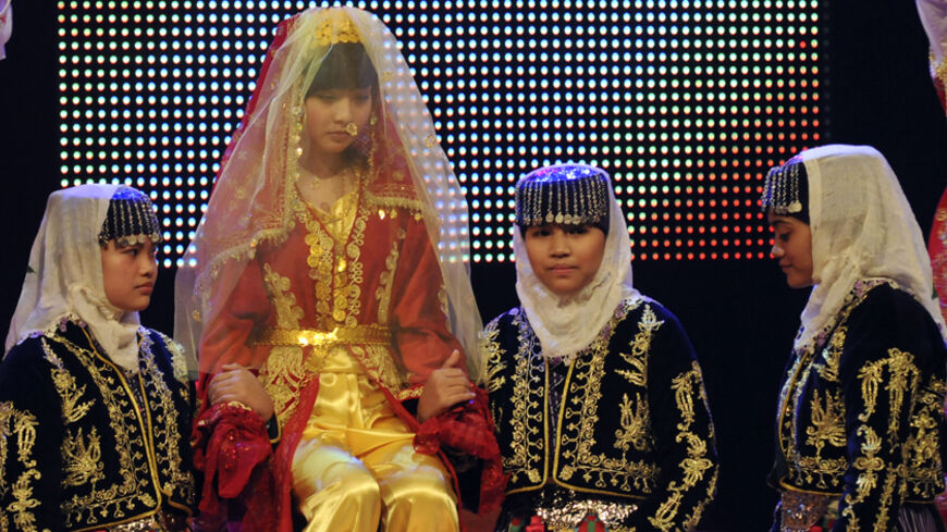 School girls perform during the singing competition of the Turkish Language Olympics in Istanbul June 3, 2009. The Turkish Language Olympics -- in its seventh year -- has drawn 700 children from 115 countries to Turkey to compete in singing, poetry reciting and prose composition, and receive encouragement in their studies with a visit to the president. Picture taken June 3, 2009. To match feature TURKEY-RELIGION/SCHOOLS     REUTERS/Halit Omer Camci (TURKEY EDUCATION SOCIETY) - RTR24DSP