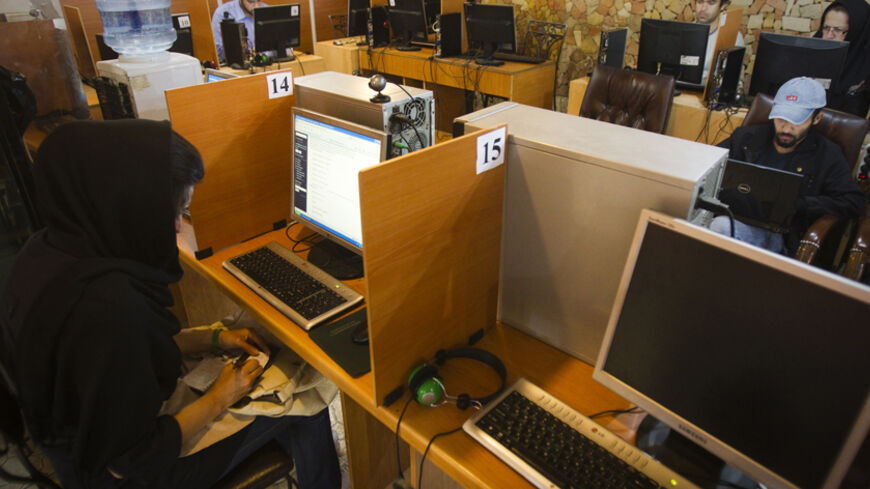 Customers use computers at an internet cafe in Tehran May 9, 2011. Websites like Facebook, Twitter, YouTube and countless others were banned shortly after the re-election of Iran's President Mahmoud Ahmadinejad and the huge street protests that followed. Seen by the government as part of a "soft war" waged by the enemies of the Islamic Republic, social networking and picture sharing sites were a vital communication tool for the anti-Ahmadinejad opposition -- more than a year before they played a similar rol