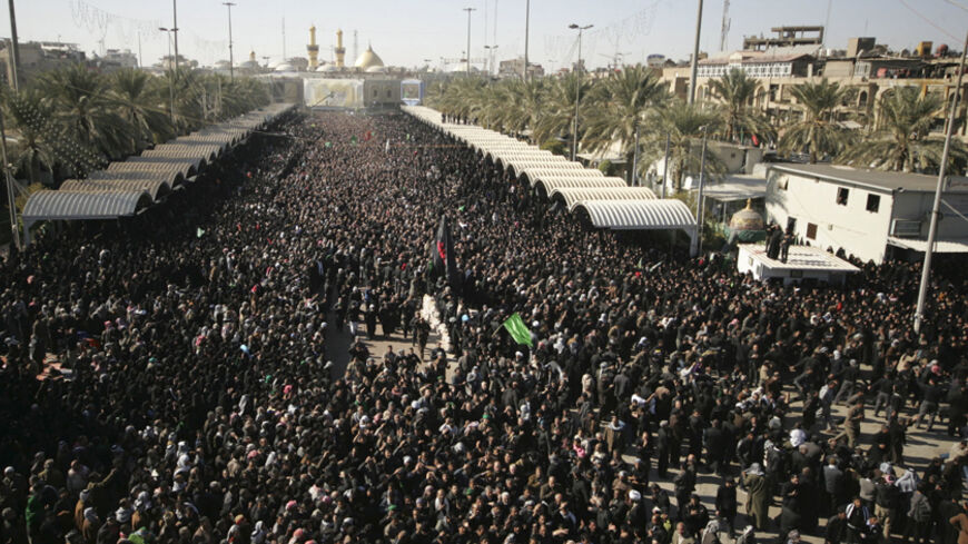 Shi'ite pilgrims gather at the Imam Hussein shrine during a ceremony marking Ashura in the holy city of Kerbala, 110 km (68 miles) south of Baghdad December 6, 2011. The festival, commemorated by Shi'ite Muslims, marks the martyrdom of the Prophet Mohammad's grandson Hussein in the battle of Karbala in Iraq in the year 680. REUTERS/Mushtaq Muhammed (IRAQ - Tags: RELIGION) - RTR2UWJ7
