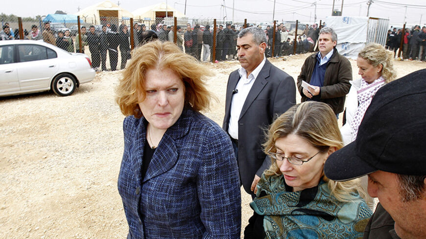 Anne C. Richard (L), assistant secretary of state for population, refugees, and migration, and Nancy Lindborg (front, 2nd R), USAID assistant administrator for democracy, conflict, and humanitarian assistance, visit the Al Zaatri Syrian refugee camp in the Jordanian city of Mafraq, near the border with Syria January 28, 2013.  REUTERS/Ali Jarekji (JORDAN - Tags: POLITICS CIVIL UNREST) - RTR3D2Y8