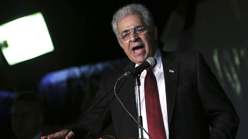 Presidential candidate Hamdeen Sabahi delivers a speech in front of his supporters during a rally in central Cairo May 23, 2014. Egyptians vote next week in an election expected to make former army chief Abdel Fattah al-Sisi president, marking a revival of strongman rule three years after the downfall of Hosni Mubarak. REUTERS/Asmaa Waguih (EGYPT - Tags: POLITICS ELECTIONS) - RTR3QLCJ