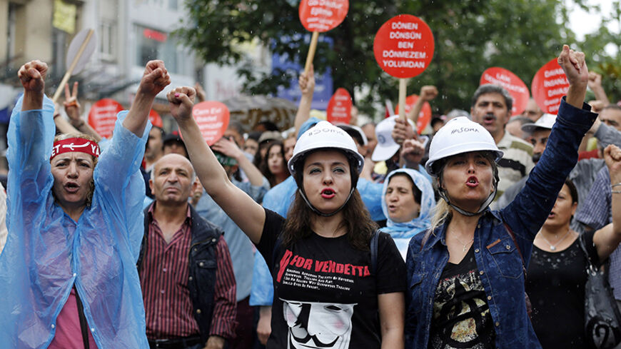 Alevi demonstrators shout anti-goverment slogans during a protest against the latest violence in Okmeydani, a working-class district in the center of the city, in Istanbul May 25, 2014. Two people died last week after clashes between Turkish police and protesters in Okmeydani, a working-class district of Istanbul, stirring fears of further unrest as the anniversary of last year's anti-government demonstrations approaches. Okmeydani is home to a community of Alevis, a religious minority in mainly Sunni Musli
