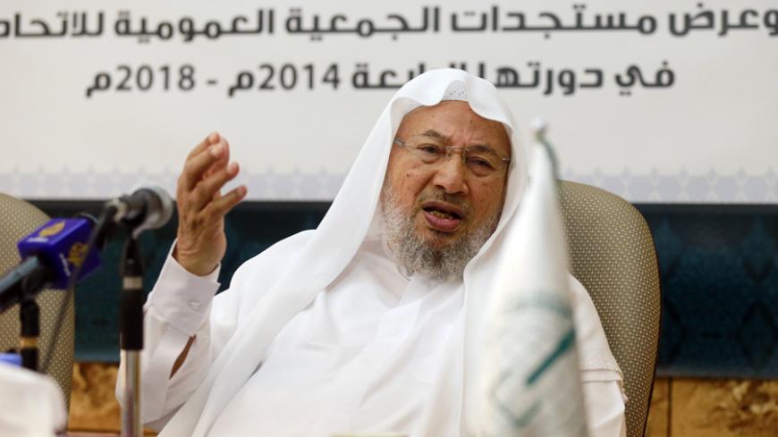 Chairman of the International Union of Muslim Scholars Youssef al-Qaradawi speaks during a news conference in Doha June 23, 2014. The influential Sunni Muslim cleric said on Monday that only dialogue could solve Iraq's crisis, sounding a conciliatory note on the threat posed by Sunni Islamist insurgents that could further polarise the Middle East along sectarian lines. Picture taken June 23.     REUTERS/Mohammed Dabbous (QATAR - Tags: RELIGION POLITICS CIVIL UNREST) - RTR3VSK2