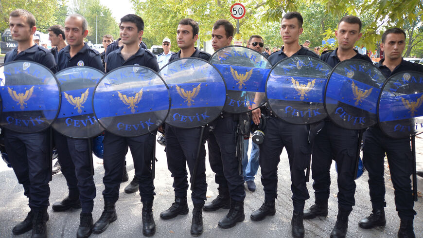 Riot police block a street leading to Presidential Palace of Cankaya as members of Turkish Youth Union (TGB) protest against president-elect Tayyip Erdogan in Ankara August 11, 2014. Erdogan began the process of picking his successor as prime minister on Monday, a figure he hopes will triumph in next year's general election and secure his goal of forging a powerful presidency.
 REUTERS/Stringer (TURKEY  - Tags: POLITICS ELECTIONS CIVIL UNREST) - RTR420KI