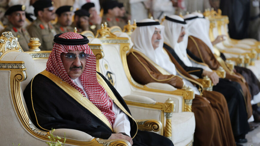Saudi Interior Minister Prince Mohammed bin Nayef bin Abdul Aziz (L) attends a military parade which is held in preparation for the annual Haj pilgrimage in the holy city of Mecca September 28, 2014. REUTERS/Muhammad Hamed (SAUDI ARABIA - Tags: RELIGION MILITARY ROYALS POLITICS) - RTR482C5