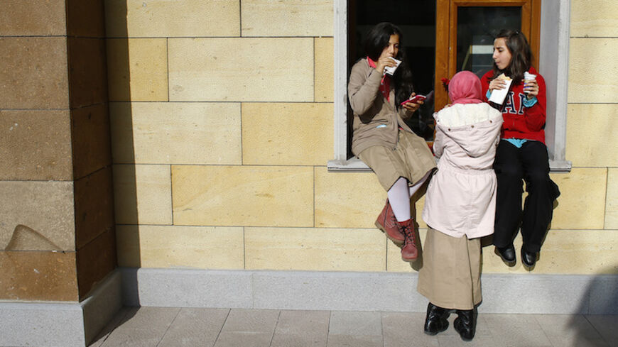 Students of Tevfik Ileri Imam Hatip School eat and chat during a break in Ankara November 18, 2014. Turkey has seen a sharp rise in religious schooling under reforms which President Tayyip Erdogan casts as a defence against moral decay, but which opponents see as an unwanted drive to shape a more Islamic nation. Almost a million students are enrolled in "imam hatip" schools this year, up from just 65,000 in 2002 when Erdogan's Islamist-rooted AK Party first came to power, he told the opening of one of the s