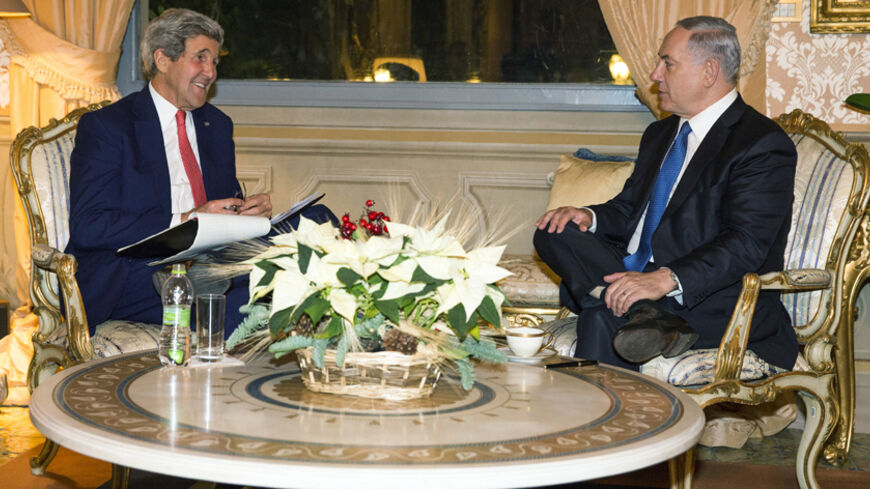 U.S. Secretary of State John Kerry (L) meets with Israeli Prime Minister Benjamin Netanyahu at Villa Taverna in Rome December 15, 2014. Netanyahu said before talks on Monday with Kerry that he would defy any United Nations move to "dictate" a time frame for withdrawal from land Palestinians seek for a state. REUTERS/Evan Vucci/Pool (ITALY - Tags: POLITICS) - RTR4I3PF