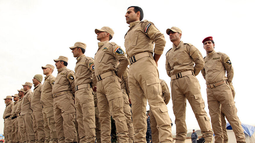 Sunni volunteers from Mosul take part in military training as they prepare to fight against militants of the Islamic State on the outskirts of Dohuk province December 8, 2014. Picture taken December 8, 2014.    REUTERS/Ari Jalal  (IRAQ - Tags - Tags: MILITARY POLITICS CIVIL UNREST) - RTR4IEJV