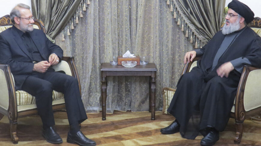 Lebanon's Hezbollah leader Sayyed Hassan Nasrallah (R) meets with Iranian Parliament Speaker Ali Larijani in this handout picture released by the Hezbollah Media office and received by Reuters on December 23, 2014. REUTERS/Hezbollah Media Office/Handout via Reuters (LEBANON - Tags: POLITICS)   ATTENTION EDITORS - THIS PICTURE WAS PROVIDED BY A THIRD PARTY. REUTERS IS UNABLE TO INDEPENDENTLY VERIFY THE AUTHENTICITY, CONTENT, LOCATION OR DATE OF THIS IMAGE. FOR EDITORIAL USE ONLY. NOT FOR SALE FOR MARKETING O