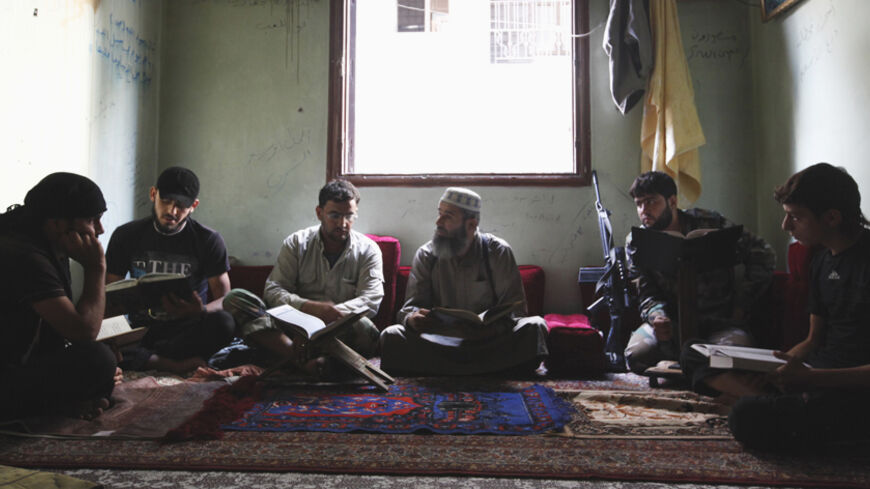 Free Syrian Army members take Islam lessons in Aleppo's Saif al-Dawla district, September 18, 2013. REUTERS/Loubna Mrie (SYRIA - Tags: POLITICS CIVIL UNREST CONFLICT TPX IMAGES OF THE DAY RELIGION) - RTX13QCR