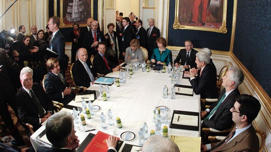 French Foreign Minister Laurent Fabius (3rd L), EU envoy Catherine Ashton (6th L), U.S. Secretary of State John Kerry (3rd R) and Britain's Foreign Secretary Philip Hammond (front L) sit a a table during talks in Vienna November 21, 2014. Iran, the United States, Britain, France, Germany, Russia and China began the final round of negotiations on a nuclear deal on Tuesday. Officials close to the talks have said the two sides are unlikely to secure a final agreement and may need to extend the negotiations. R