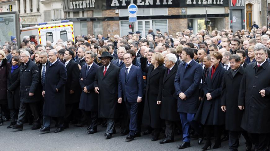 (From L) Danish Prime Minister Helle Thorning-Schmidt, Mayor of Paris Anne Hidalgo, European Commission President Jean-Claude Juncker, Israeli Prime Minister Benjamin Netanyahu, former French President Nicolas Sarkozy, Malian President Ibrahim Boubacar Keita, French President Francois Hollande, German Chancellor Angela Merkel, Palestinian president Mahmud Abbas, Italian Prime Minister Matteo Renzi, Swiss President Simonetta Sommaruga and Turkish Prime Minister Ahmet Davutoglu take part in a Unity rally Marc