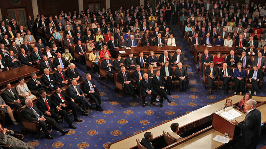 Israeli Prime Minister Benjamin Netanyahu addresses a joint meeting of Congress in the House Chamber of the U.S. Capitol in Washington, May 24, 2011. Netanyahu's vision for ending conflict with Palestinians put "more obstacles" in front of the Middle East peace process, the spokesman for the Palestinian President Mahmoud Abbas said.  REUTERS/Molly Riley (UNITED STATES - Tags: POLITICS) - RTR2MUAQ