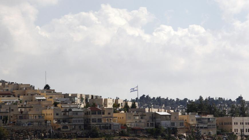 Israel's national flag flutters in the settlement of Ramat Shlomo November 4, 2014. An Israeli government committee on Monday advanced plans for 500 settler homes in East Jerusalem, an official said, in the face of disapproval from the United States at construction on occupied Palestinian land. The Interior Ministry panel's preliminary approval of the new homes for Ramat Shlomo, a neighbourhood built on West Bank territory captured in the 1967 war and annexed to Jerusalem in a move not recognised abroad, wa