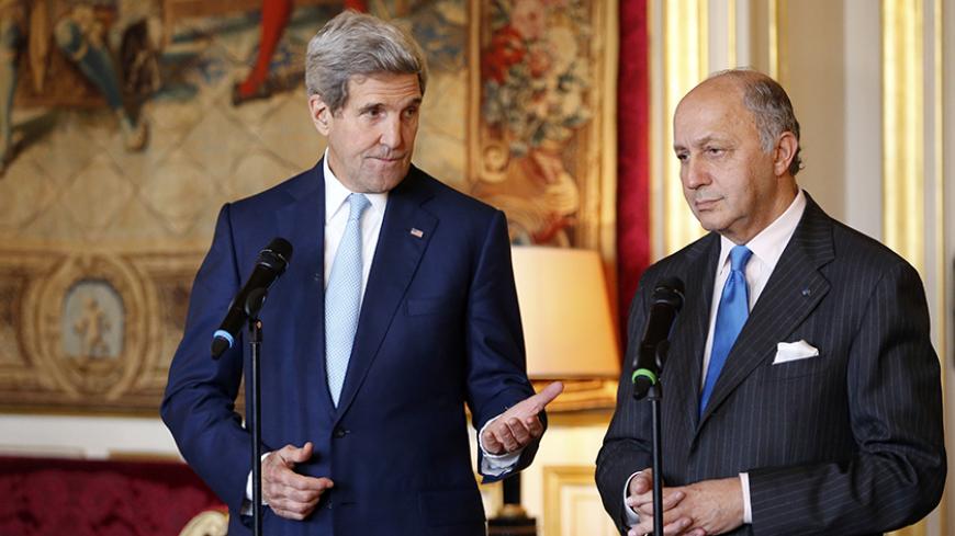 French Foreign Minister Laurent Fabius (R) and U.S. Secretary of State John Kerry speak during joint statement at the Quai d'Orsay Foreign Affairs ministry in Paris November 20, 2014. U.S. Secretary of State John Kerry is in Paris for talks with the French and Saudi foreign ministers as part of a last-minute push to secure a nuclear deal with Iran. Kerry will travel to Vienna later on Thursday to participate in a conference with world powers and Iran on Tehran's nuclear programme, a spokeswoman said. REUTE