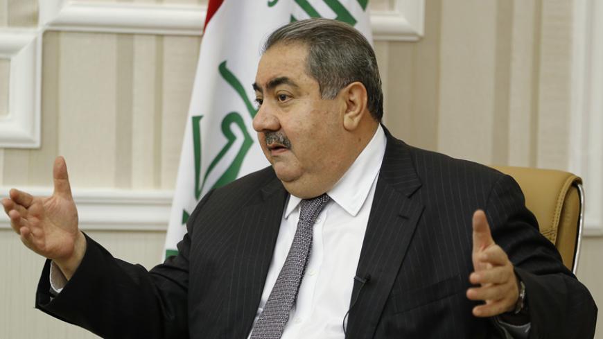 Iraq's Finance Minister Hoshiyar Zebari speaks during an interview with Reuters in Baghdad November 26, 2014. Zebari called for deep-rooted reforms to stamp out corruption in a military that collapsed in the face of an Islamic State advance, as he prepares to spend nearly a quarter of the 2015 budget on defence. Picture taken November 26, 2014. REUTERS/Thaier Al-Sudani (IRAQ - Tags: BUSINESS POLITICS MILITARY CIVIL UNREST) - RTR4FT0T
