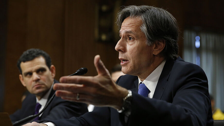 U.S. Deputy Secretary of State Antony Blinken (R) and Treasury Under Secretary for Terrorism and Financial Intelligence David Cohen (L) testify before the Senate Foreign Relations Committee in Washington January 21, 2015. Top U.S. Treasury and State Department officials said on Wednesday that, despite reports, Russia had not entered into oil-for-goods deals with Iran in violation of international sanctions.  REUTERS/Gary Cameron   (UNITED STATES - Tags: POLITICS BUSINESS) - RTR4MCBJ