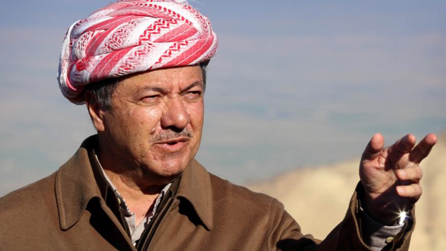 Iraqi Kurdish leader Masoud Barzani speaks to journalists on December 21, 2014 during a visit to Mount Sinjar, west of the northern Iraqi city of Mosul. Barzani hailed advances by peshmerga fighters against the Islamic State jihadist group (IS) as they battled the militants for a northern town, backed by US-led strikes. AFP PHOTO / SAFIN HAMED (Photo credit should read SAFIN HAMED/AFP/Getty Images)