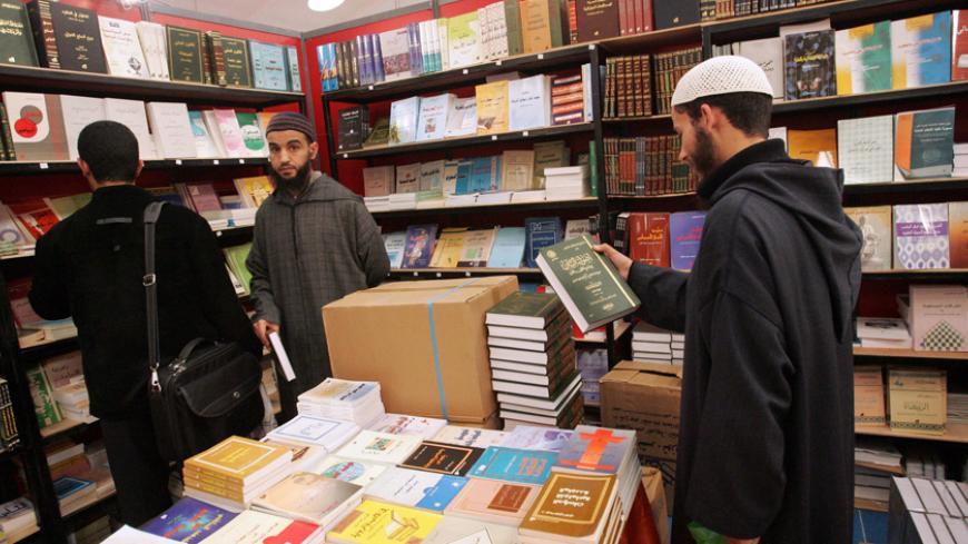 Rabat, MOROCCO: Visitors attend the 13th edition of the Casablanca International Book Fair, 13 February 2007. The event gathers some 600 exhibitors from sixty different countries. The Justice and Development party (PJD) accused the Ministry of Culture of preventing Islamic publishing companies from exhibiting.  AFP PHOTO / ABDELHAK SENNA (Photo credit should read ABDELHAK SENNA/AFP/Getty Images)