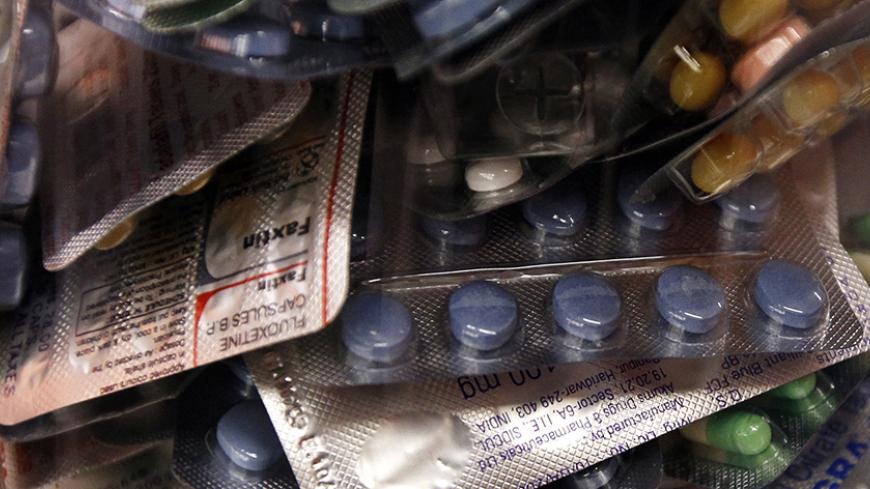 Counterfeit medicine confiscated by Swiss customs is displayed during the Swiss customs annual news conference at the Euroairport in Basel-Mulhouse February 7, 2012. Swiss customs registered 1298 cases of attempted illegal imports of medicines by post in 2011, 34 percent for the treatment of erectile dysfunction.    REUTERS/Pascal Lauener (SWITZERLAND - Tags: CRIME LAW HEALTH) - RTR2XG4B