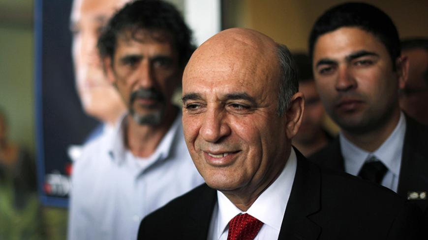 Ex-defence chief Shaul Mofaz (C) leaves after casting his ballot for the Kadima party primary election at a polling station in the central town of Kfar Saba March 27, 2012. Opinion polls predicted a close race between Tzipi Livni, Israel's former foreign minister, and Mofaz among Kadima's 100,000 eligible voters charged with choosing a candidate to challenge Prime Minister Benjamin Netanyahu in a national poll expected by next year. REUTERS/Amir Cohen (ISRAEL - Tags: POLITICS ELECTIONS) - RTR2ZY8B