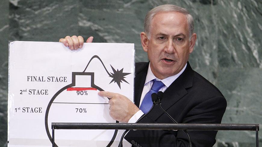 Israel's Prime Minister Benjamin Netanyahu points to a red line he has drawn on the graphic of a bomb as he addresses the 67th United Nations General Assembly at the U.N. Headquarters in New York, September 27, 2012. REUTERS/Lucas Jackson (UNITED STATES - Tags: POLITICS TPX IMAGES OF THE DAY) - RTR38I6N