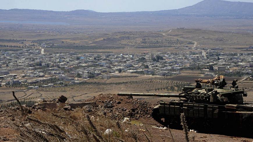 A tank belonging to the forces loyal to Syria's President Bashar al-Assad is seen in the Quneitra city countryside on September 8, 2014 during a battle with rebels, near the border fence with the Israeli-occupied Golan Heights, in this picture released by Syria's national news agency SANA. REUTERS/SANA/Handout via Reuters (SYRIA - Tags: CIVIL UNREST MILITARY POLITICS CONFLICT) ATTENTION EDITORS - THIS PICTURE WAS PROVIDED BY A THIRD PARTY. REUTERS IS UNABLE TO INDEPENDENTLY VERIFY THE AUTHENTICITY, CONTENT,