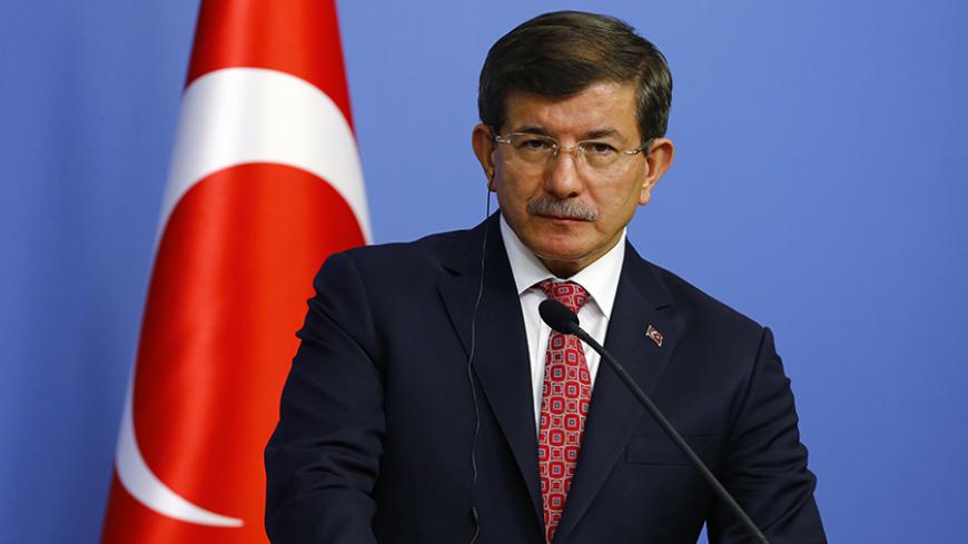 Turkey's Prime Minister Ahmet Davutoglu addresses the media in Ankara December 11, 2014. REUTERS/Umit Bektas (TURKEY - Tags: POLITICS) - RTR4HNSC
