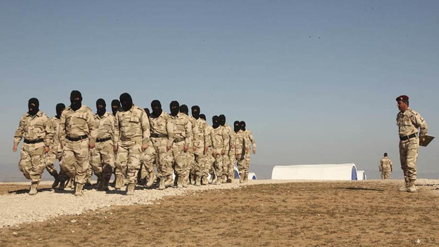 Volunteers from Mosul take part in military training as they prepare to fight against Islamic State militants, on the outskirts of Dohuk province January 24, 2015. REUTERS/Ari Jalal (IRAQ - Tags: CIVIL UNREST MILITARY CONFLICT) - RTR4MQXV