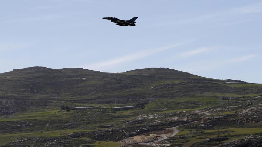 A plane belonging to the Jordanian Royal Air Force flies over the headquarters of the family clan of pilot Muath al-Kasaesbeh in the city of Karak February 4, 2015. Jordan hanged two Iraqi jihadists on Wednesday including a female militant in response to an Islamic State video showing captured Jordanian pilot Muath al-Kasaesbeh being burnt alive by the hardline group. Islamic State had demanded the release of the woman, Sajida al-Rishawi, in exchange for a Japanese hostage who it later beheaded. Sentenced t