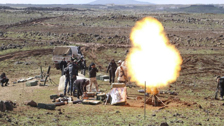 Rebel fighters fire a mortar towards forces loyal to Syria's President Bashar al-Assad who are stationed in Tel Merhi and Deir Adass villages, from the northwestern countryside of Deraa February 18, 2015. Heavy fighting in southern Syria has killed scores of pro-government and insurgent fighters in the past week, a group monitoring Syria's war said on Sunday, forecasting even fiercer violence as the weather clears. Picture taken February 18. REUTERS/Wsam Almokdad (SYRIA - Tags: POLITICS CIVIL UNREST CONFLIC