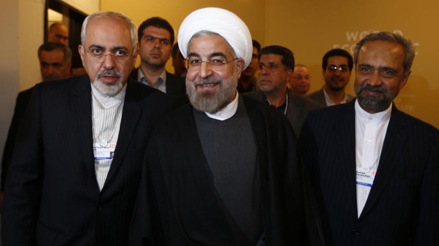 Iran's President Hassan Rouhani, Foreign Minister Mohammad Javad Zarif (L) and Mohammad Nahavandian the Head of Iran Presidential Office (R) arrive for a meeting during the annual meeting of the World Economic Forum (WEF) in Davos January 22, 2014.                   REUTERS/Denis Balibouse (SWITZERLAND  - Tags: POLITICS BUSINESS TPX IMAGES OF THE DAY)   - RTX17PZ0