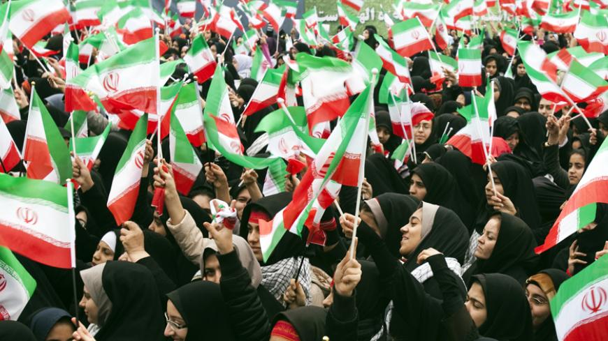 EDITORS' NOTE: Reuters and other foreign media are subject to Iranian restrictions on their ability to film or take pictures in Tehran.
Students wave Iranian national flags as they take part in a rally to mark the 32nd anniversary of the Islamic Revolution in Tehran February 11, 2011. Hundreds of thousands turned out on Friday to mark the 32nd anniversary of Iran's Islamic Revolution in a rally the clerical establishment billed as a chance to show solidarity with "Islamic" protesters in Egypt. REUTERS/Ra