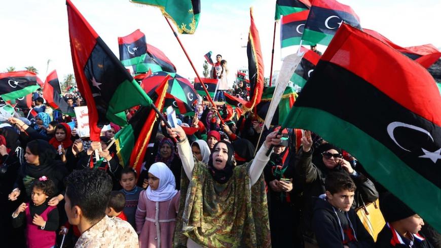 Libyans celebrate in Tripoli's landamark Martyrs square on February 17, 2015 the upcoming fourth anniversary of the Libyan revolution which toppled strongman Moamer Kadhafi. Islamist militants have thrived in Libya since Kadhafi was toppled and killed in the NATO-backed 2011 uprising, with authorities struggling to contain dozens of militant groups with diverse motivations and ideologies. AFP PHOTO / MAHMUD TURKIA        (Photo credit should read MAHMUD TURKIA/AFP/Getty Images)