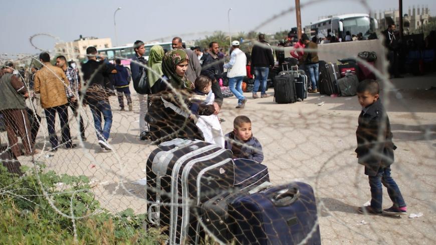 Palestinians gather at the Rafah border crossing in the southern Gaza Strip as they await permission to enter Egypt on March 10, 2015. Egypt is due to reopen its Rafah border crossing with Gaza for two days, for the fourth time since it was closed after a suicide bombing in the Sinai Peninsula in October 2014. AFP PHOTO / SAID KHATIB        (Photo credit should read SAID KHATIB/AFP/Getty Images)