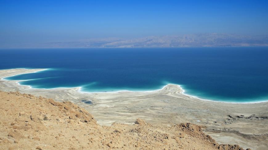 A picture taken on February 8, 2014 near Ein Gedi, in Israel shows the Dead Sea shoreline shaped by the decline in water levels as a result of the drying up. The Dead Sea, 400 meters below sea level, is the lowest point on earth and its mineral-rich waters and shores have been celebrated for their cleansing, healing and therapeutic properties. In the background is the Jordanian coast. AFP PHOTO THOMAS COEX (Photo credit should read THOMAS COEX/AFP/Getty Images)