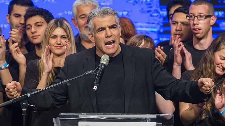 Israeli MP and chairperson of center-right Yesh Atid party, Yair Lapid, delivers a speech outlining the Yesh Atid campaign and presenting the party's list for the 20th Knesset, on January 26, 2015 in the Israeli city of Rishon Letzion, ahead of the March 17 general elections. AFP PHOTO /JACK GUEZ (Photo credit should read JACK GUEZ/AFP/Getty Images)