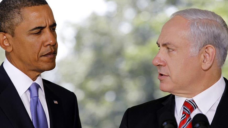 U.S. President Barack Obama (L) listens as Israeli Prime Minister Benjamin Netanyahu delivers a statement to the media from the Colonnade outside the Oval Office of the White House in Washington September 1, 2010. REUTERS/Jason Reed (UNITED STATES - Tags: POLITICS IMAGES OF THE DAY) - RTR2HSTC