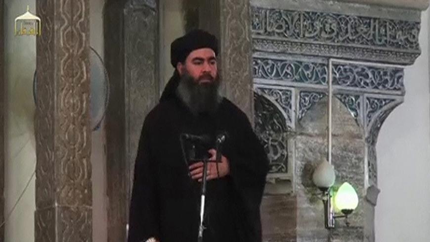 A man purported to be the reclusive leader of the militant Islamic State Abu Bakr al-Baghdadi has made what would be his first public appearance at a mosque in the centre of Iraq's second city, Mosul, according to a video recording posted on the Internet on July 5, 2014, in this still image taken from video. There had previously been reports on social media that Abu Bakr al-Baghdadi would make his first public appearance since his Islamic State in Iraq and the Levant (ISIL) changed its name to the Islamic S