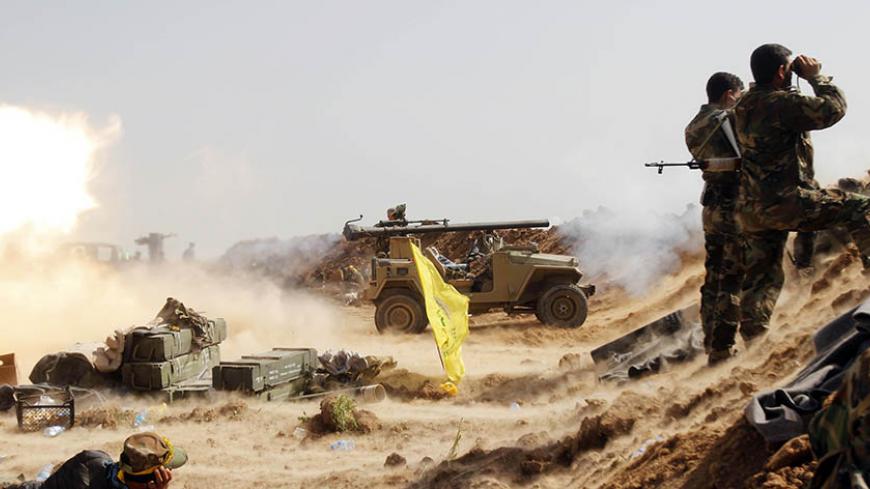Shi'ite fighters from Hashid Shaabi forces launch a rocket during clashes with Islamic State militants on the front line at the Shi'ite Turkman village of Bashir, 20km south of Kirkuk, March 14, 2015. Kurdish peshmerga forces, backed by Shi'ite militia fighters, have been attacking Islamic State-held towns and villages south and west of the oil-rich city of Kirkuk, peshmerga sources said. REUTERS/Ako Rasheed (IRAQ - Tags: CIVIL UNREST CONFLICT POLITICS MILITARY) - RTR4TCBR