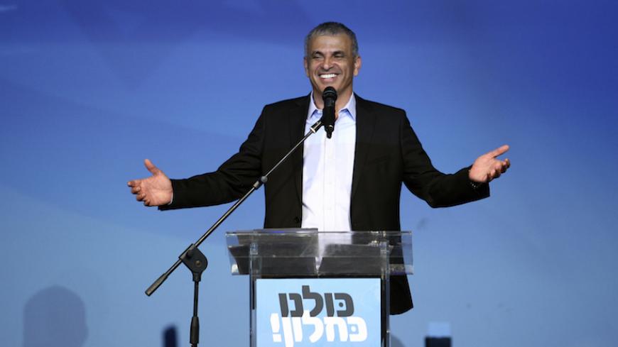 Moshe Kahlon (C), head of the new centrist party Kulanu (All of Us), addresses supporters at party headquarters in Tel Aviv March 18, 2015. Prime Minister Benjamin Netanyahu claimed victory in Israel's election on Tuesday after exit polls showed he had erased his center-left rivals' lead with a hard rightward shift that saw him disavow a commitment to negotiate a Palestinian state. A new centrist party led by former communications minister Kahlon could be the kingmaker in coalition talks. REUTERS/Stringer