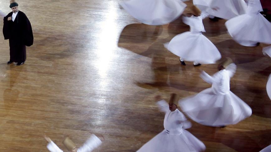 Whirling Dervishes perform during the Mevlana's 737th Reunion Anniversary International Commemoration Ceremonies in the central Turkish city of Konya, December 7, 2010. Mevlana Jalaluddin Rumi is an Anatolian philosopher, poet and the founder of the Whirling Dervish and Mevlevi sect.   REUTERS/Osman Orsal (TURKEY - Tags: RELIGION) - RTXVII0